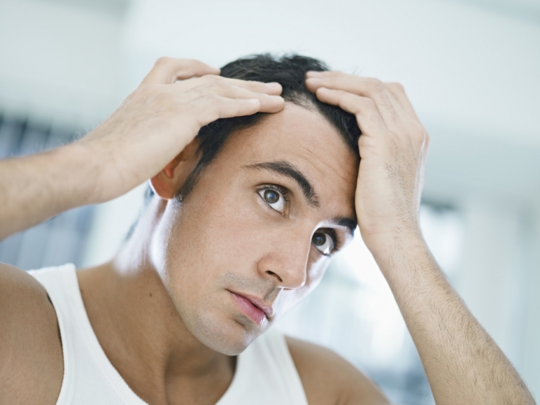 Man checking on his hair